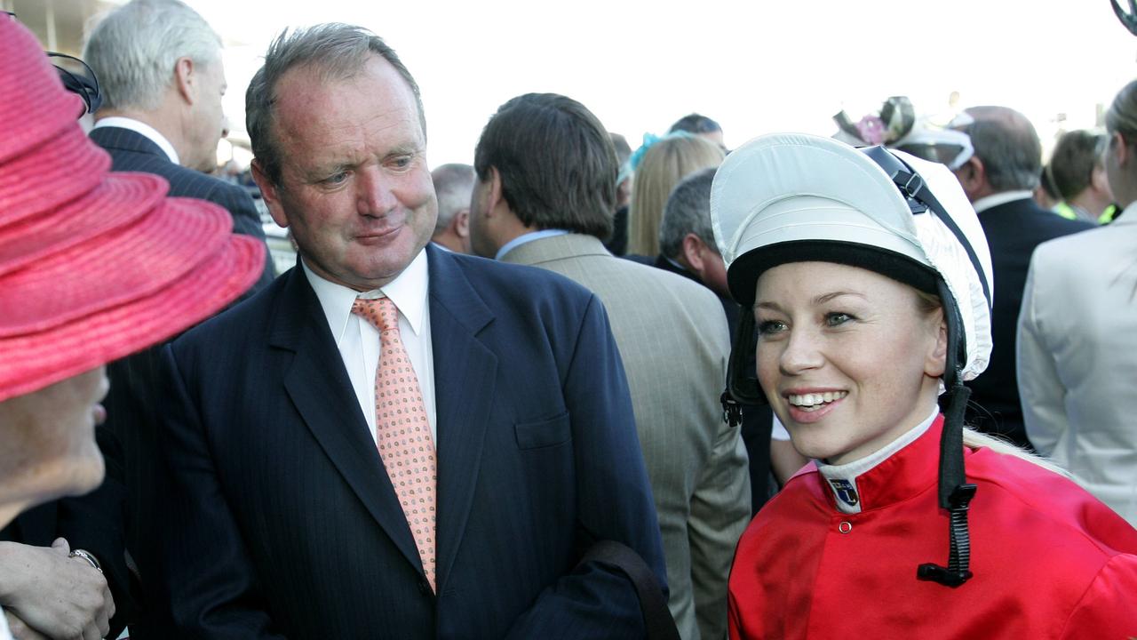 Apprentice jockey Kathy O'Hara with trainer Guy Walter, before her ride on Wild Iris in the Caulfield Cup (race 8).