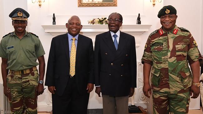 A screengrab from Zimbabwe TV shows President Robert Mugabe (second right) with Defence Forces Commander General Constantino Chiwenga (right) and South African envoys in Harare.