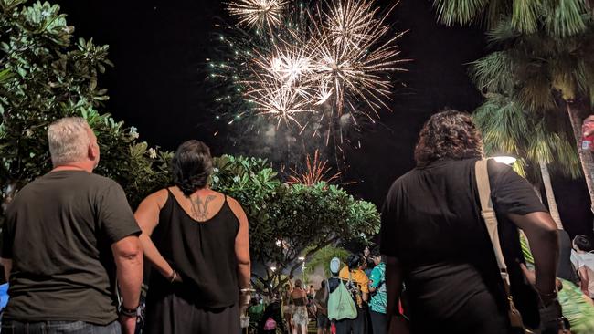 Revellers enjoying the fireworks at Darwin Waterfront Precinct for the New Year's Eve 2024. Picture: Alex Treacy