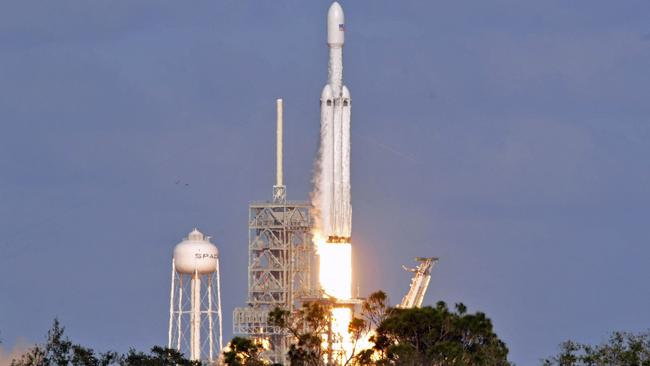 The SpaceX Falcon Heavy launches from Pad 39A at the Kennedy Space Center in Florida, on February 6, 2018. The world's most powerful rocket, SpaceX's Falcon Heavy, blasted off on its highly anticipated maiden test flight, carrying CEO Elon Musk's cherry red Tesla roadster to an orbit near Mars. Picture: Bruce Weaver/AFP