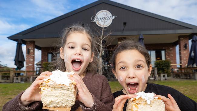 Violet, 5 and Rose, 8 with vanilla slices from Donato Cafe 1980. Picture: Jason Edwards