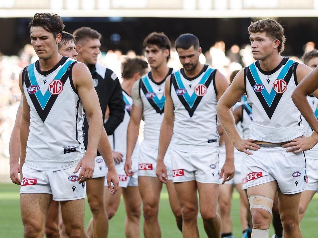 MELBOURNE, AUSTRALIA - APRIL 20: Port Adelaide leave the field looking dejected after a loss during the 2024 AFL Round 06 match between the Collingwood Magpies and the Port Adelaide Power at the Melbourne Cricket Ground on April 20, 2024 in Melbourne, Australia. (Photo by Dylan Burns/AFL Photos via Getty Images)