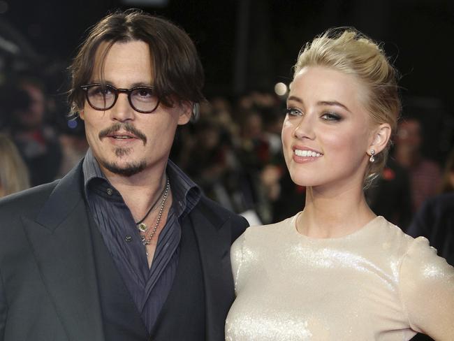 Johnny Depp, left, and Amber Heard in happier times. Picture: AP.