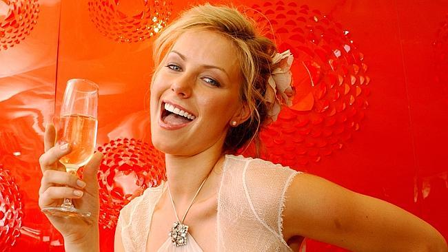 30 Oct 2004 Derby Day Fashion at Flemington - Miss Universe, Jennifer Hawkins - headshot profile glass white wine?