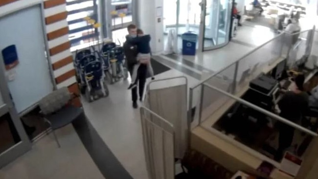 Hospital security footage shows Christopher Gregor carrying his 6-year-old son’s limp body into a hospital. Picture: Court TV.