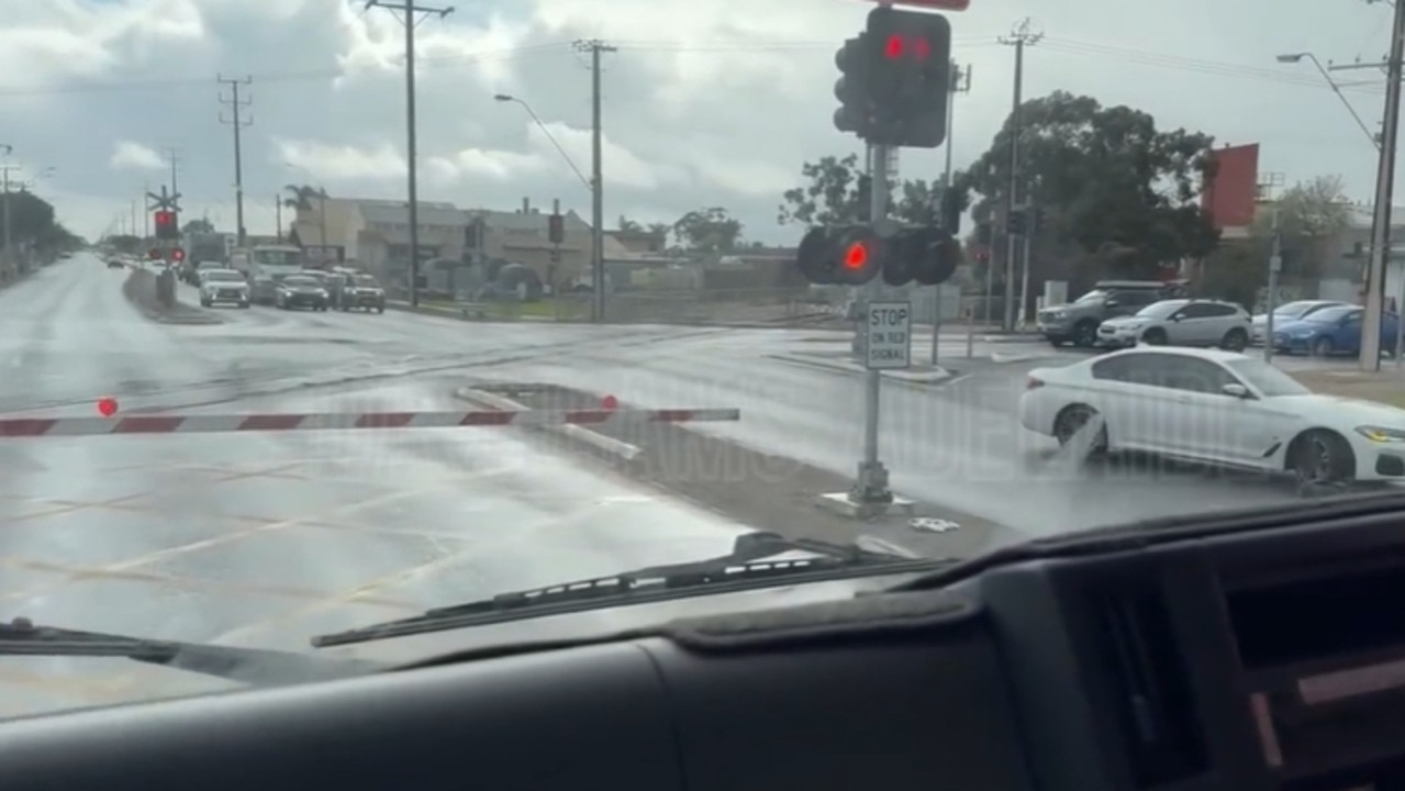 A driver has been filmed narrowly avoiding getting stuck on train tracks in Seaton. Picture: Dashcams Adelaide