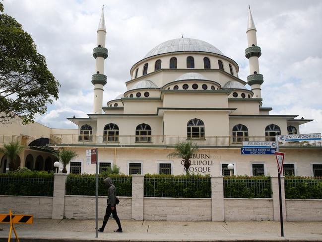 SYDNEY, AUSTRALIA - Newswire photos FEBUARY 07 2022:    A man is seen walking past the Auburn Gallipoli Mosque in Sydney ahead of the special prayer service for victims of the Turkiye earthquake. Picture: NCA Newswire / Gaye Gerard