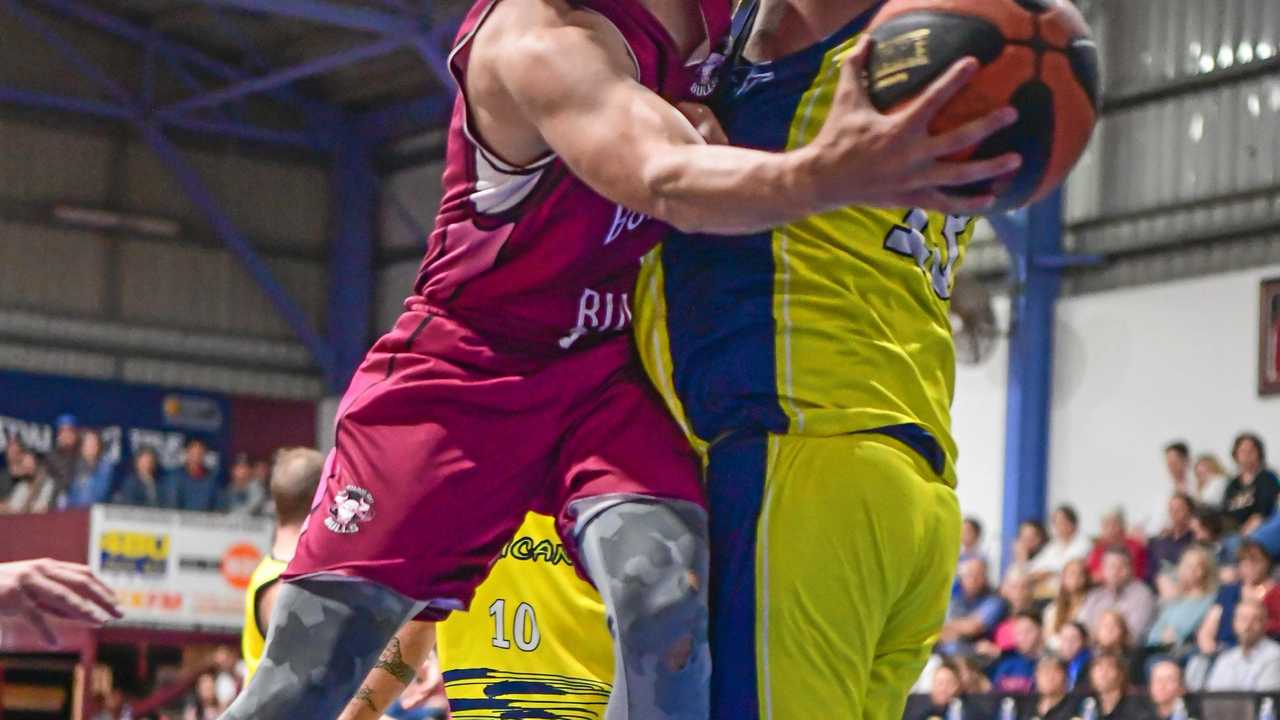 Bundabergs Isiah Richardson tries to get past Hervey Bays Leroy Soe. Picture: Brian Cassidy