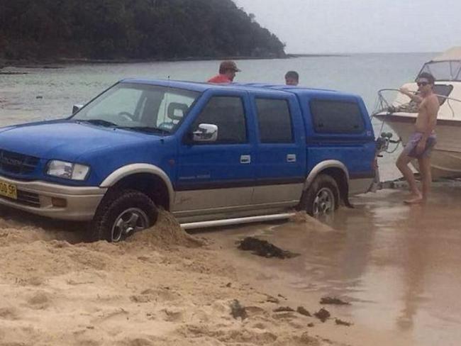 This car is stuck in the sand and the tide looks like it’s coming in. Better send for the Hoff.