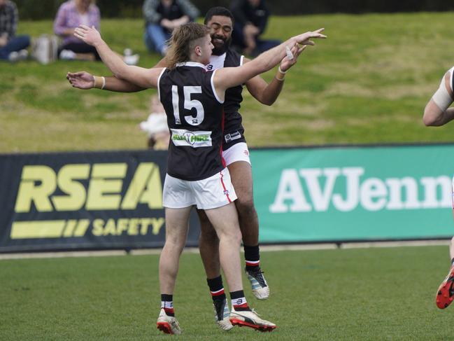 Judd Rowell (No. 15) celebrates with teammates.