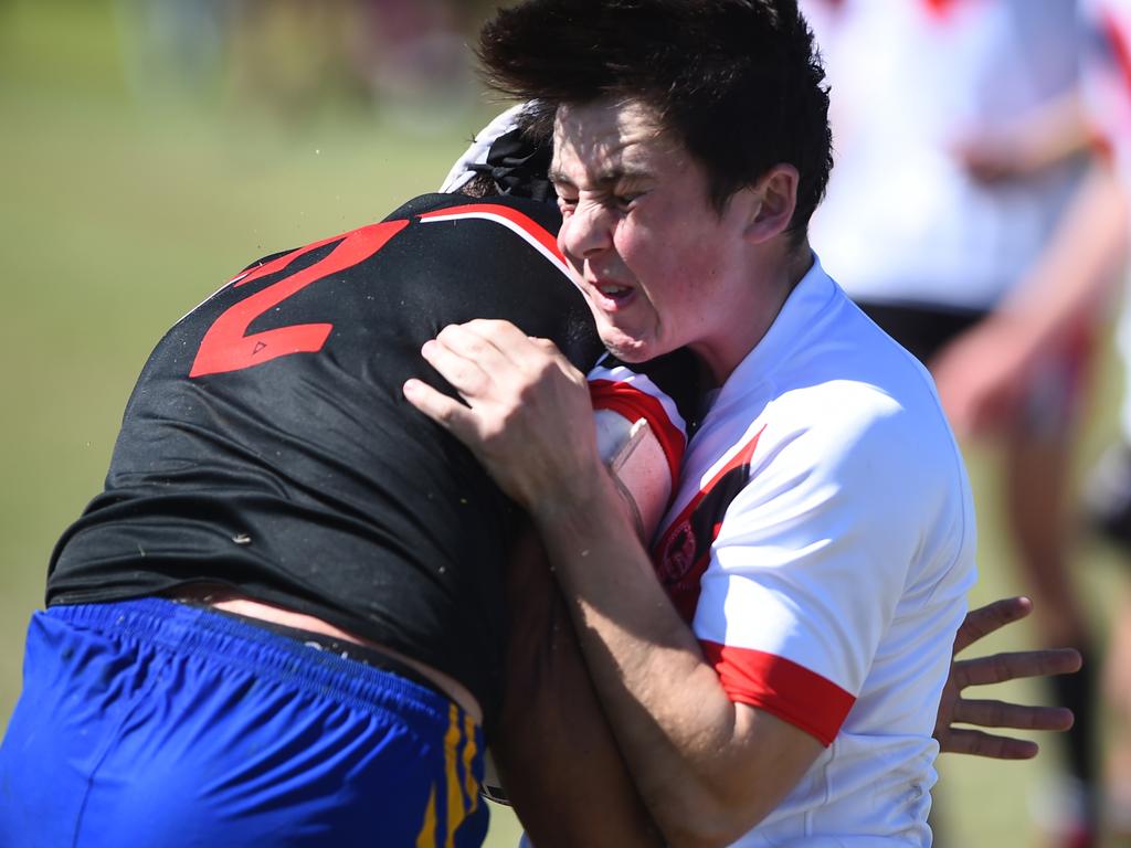 Boys Rugby League State Championship held at Northern Division, Brothers Leagues ground, Townsville. South West (black) v Wide Bay (white). 16-18 years. Ezekiel Monckton of Shalom College.