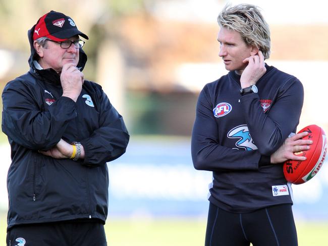 Kevin Sheedy speaks with champion James Hird, who would go on to coach the club.