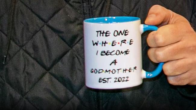 Jackie received a mug with a Friends reference that read: ‘The one where I become a godmother. Est. 2022.’ Picture: Instagram/kyleandjackieo