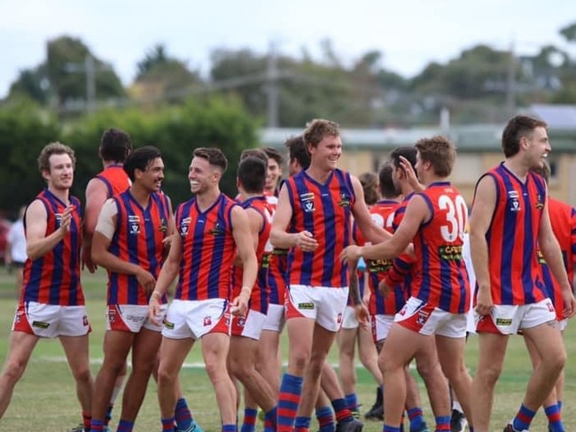 Rye celebrates its win at Somerville. The Demons are undefeated after four rounds. Picture: Rye FNC