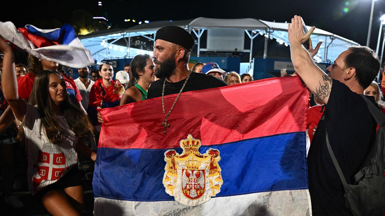 Supporters of Serbia's Novak Djokovic gather.