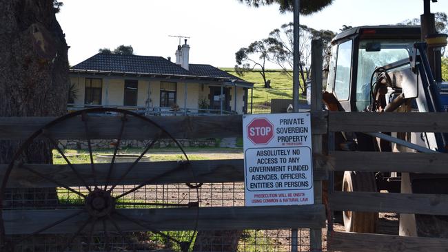 Signs outside of the property at Sandy Creek where it is reported two individuals were arrested following an armed incident'. Picture: Jason Katsaras