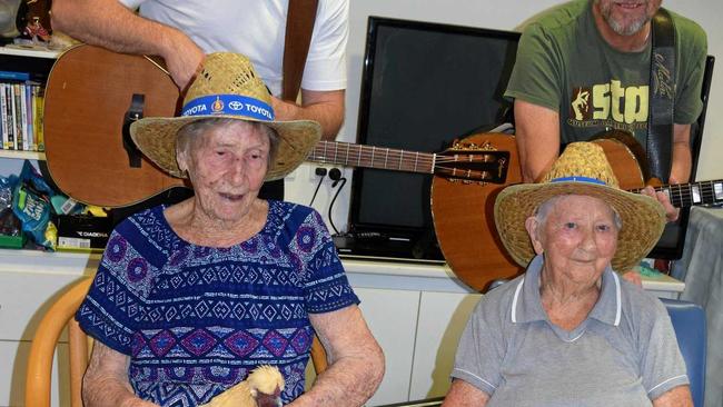 TOE-TAPPING: Dulcie Halsteed and Ev Jacobi put on their Tamworth Country Music hats when Brad Butcher and Brendan Radford paid the Biggenden Multi-Purpose Health Service a visit. Picture: Erica Murree