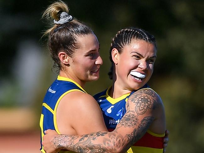 Caitlin Gould celebrates a goal with Anne Hatchard. Picture: Mark Brake/Getty Images