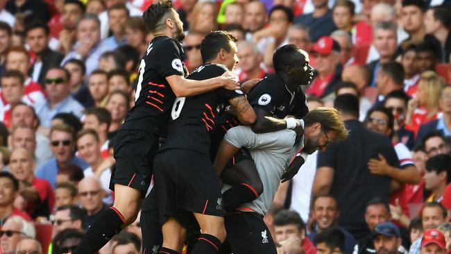 Sadio Mane of Liverpool and team mates celebrate his goal with Jurgen Klopp.