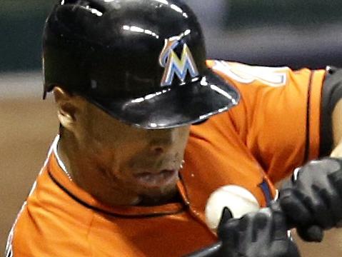 MILWAUKEE, WI - SEPTEMBER 11: Giancarlo Stanton #27 of the Miami Marlins is hit by a pitch from Mike Fiers of the Milwaukee Brewers during the top of the fifth inning at Miller Park on September 11, 2014 in Milwaukee, Wisconsin. Mike McGinnis/Getty Images/AFP == FOR NEWSPAPERS, INTERNET, TELCOS & TELEVISION USE ONLY ==