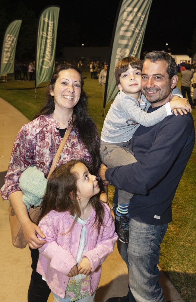 Mary and Angelo with their kids at the Symphony Under the Stars concert performed by the Queensland Symphony Orchestra in Queens Park Amphitheatre for Carnival of Flowers, Friday, October 4, 2024. Picture: Kevin Farmer