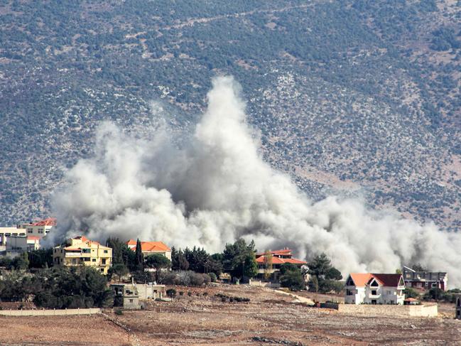 Smoke rises following an Israeli air strike on the village of Khiam in southern Lebanon near the border with Israel on October 23, 2024. Israel expanded operations in Lebanon nearly a year after Hezbollah began exchanging fire in support of its ally, Hamas, following the Palestinian group's deadly attack on Israel on October 7, 2023. (Photo by AFP)