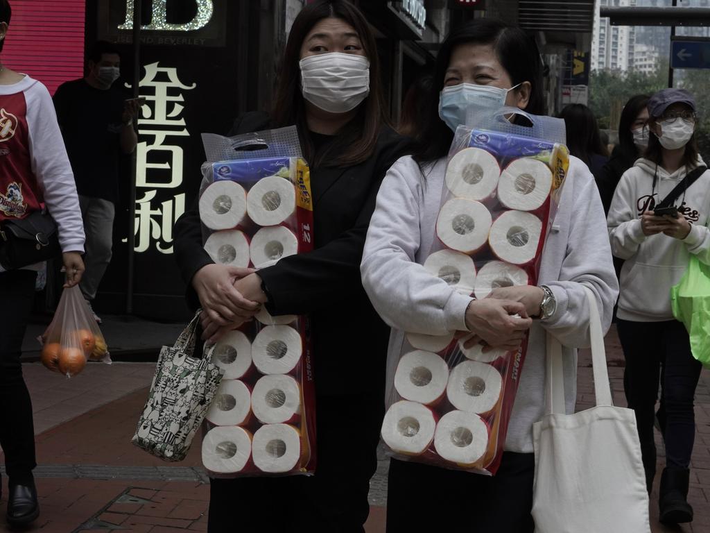 Two women in Hong Kong stock up on the essentials. Picture: Kin Cheung.