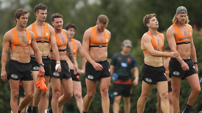 Giants players rest after a 2km time trial. (Photo by Mark Metcalfe/Getty Images)