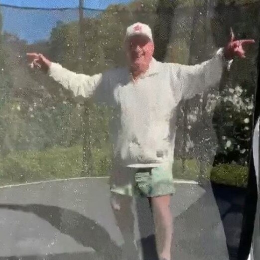 Alan Jones takes up Glenn Munsie’s challenge to bounce on a trampoline. Picture: Instagram