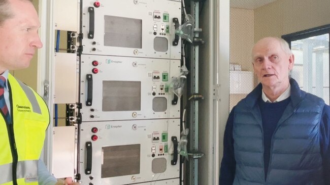 QUT’s Institute for Future Environments executive director Professor Ian Mackinnon next to a machine that converts solar energy into hydrogen fuel.