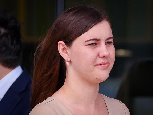 (FILES) In this file photo taken on October 14, 2022, Brittany Higgins leaves the ACT Magistrates Court in Canberra. - An Australian rape case that sparked national protests will not return to court after a mistrial, because of fears the intense public scrutiny could have a grave toll on the accuser's mental health, prosecutors said on December 2, 2022. (Photo by DAVID GRAY / AFP)