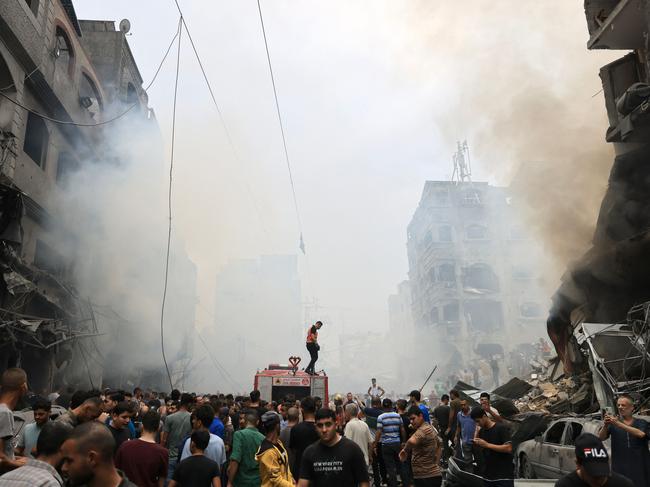 Palestinians search for survivors after an Israeli air strike on buildings in the refugee camp of Jabalia in the Gaza Strip. Picture: Mahmud Hams/AFP