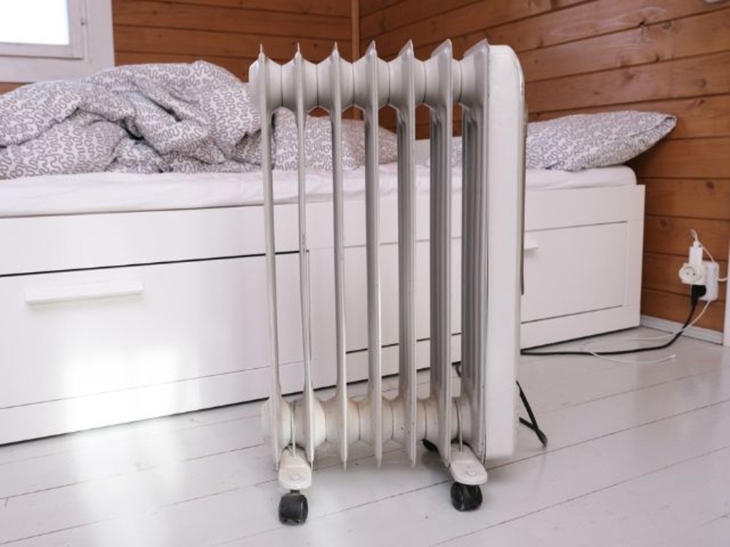 Oil heaters can be used overnight but make sure to use the timer and take extra safety precautions. Picture: iStock/Iuliia Mikhalitskaia.