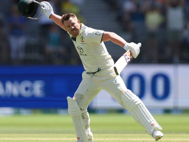 PERTH, AUSTRALIA - DECEMBER 14: David Warner of Australia celebrates after scoring a century during day one of the Men's First Test match between Australia and Pakistan at Optus Stadium on December 14, 2023 in Perth, Australia. (Photo by Paul Kane/Getty Images)