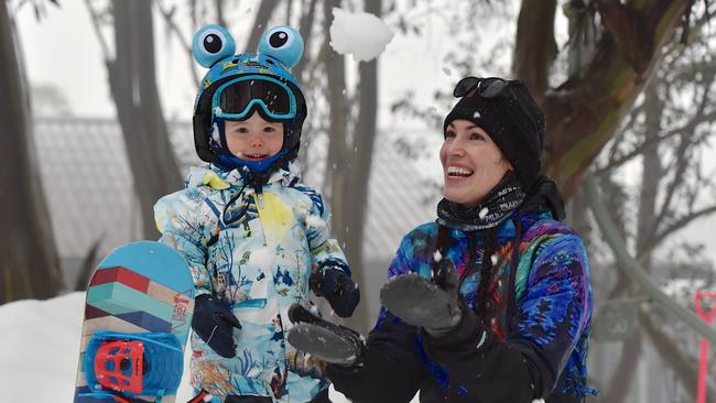 The snowfall at Falls Creek was enjoyed by two-year-old Ollie and his mum Andge. Picture: Chris Hocking