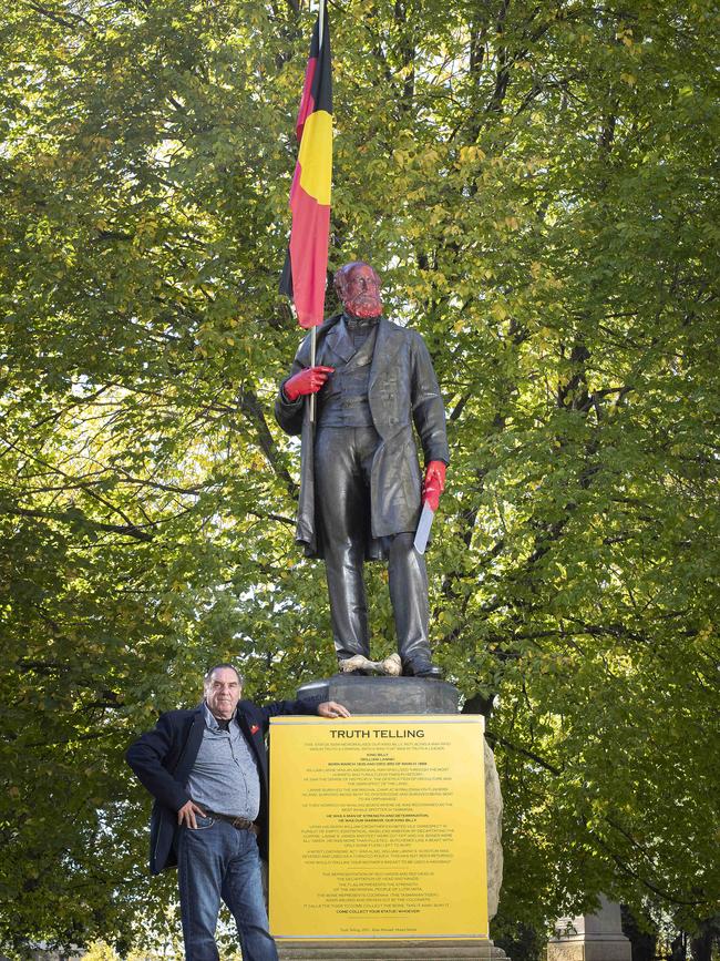 Tasmanian Aboriginal artist Allan Mansell with the William Crowther statue he transformed into 1st Nations Tasmanian King Billy at Franklin Square, Hobart. Picture: CHRIS KIDD