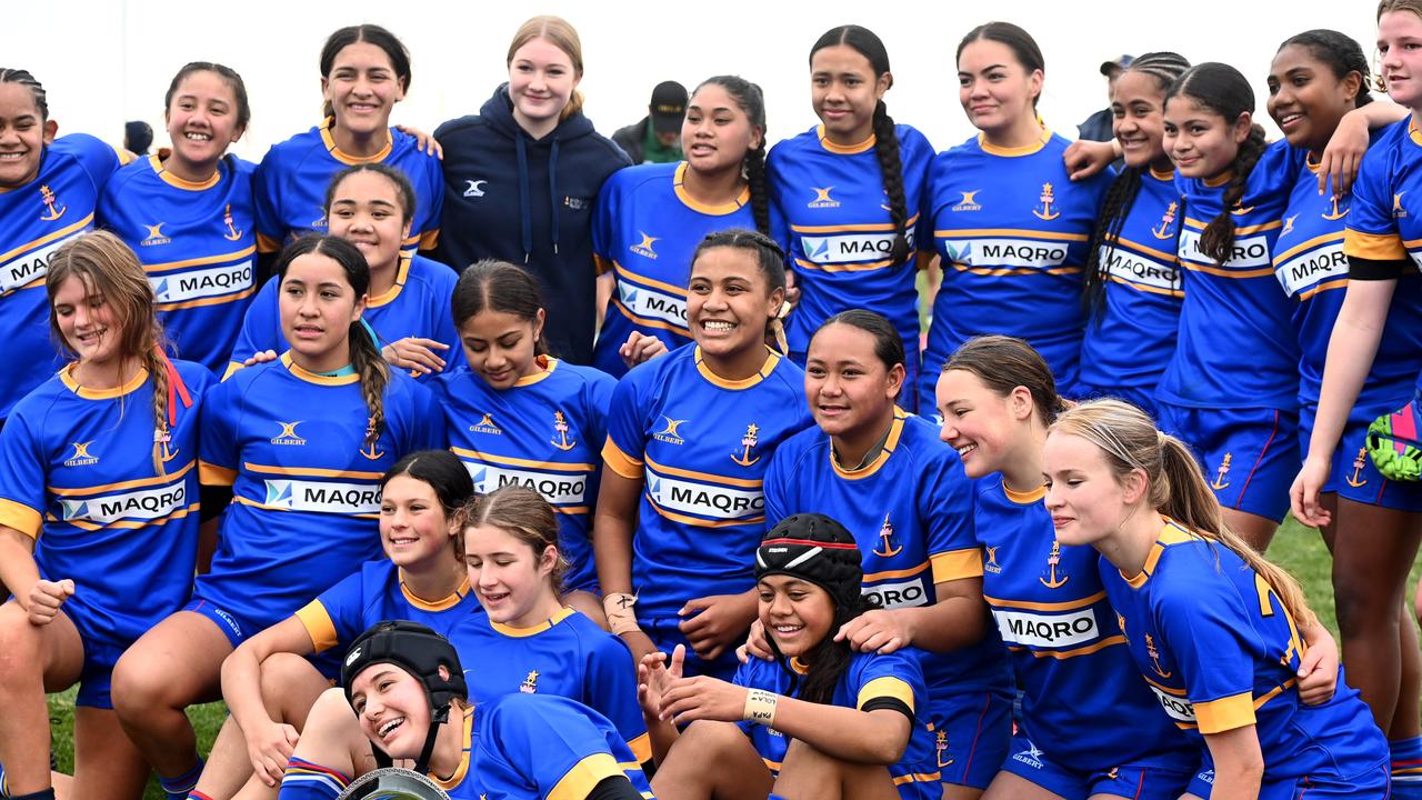 The under 14 girls team has plenty to smile about after their win.