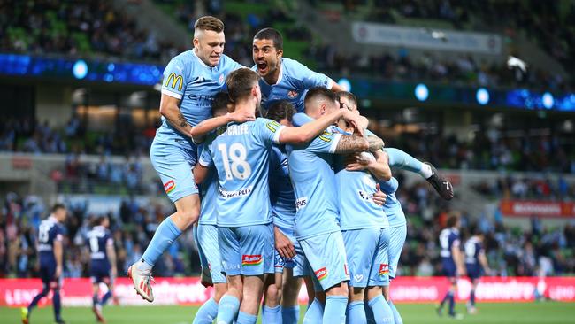 Melbourne City players celebrate a Jamie Maclaren goal in an A-League derby against Melbourne Victory. Picture: Mike Owen/Getty Images