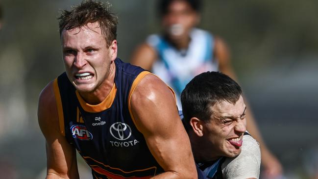 MT BARKER, AUSTRALIA - FEBRUARY 21: Jordan Dawson of the Crows tackled by  Zak Butters of the Power during the AFL practice match between Adelaide Crows and Port Adelaide Power at Mt Barker Summit Sport and Recreation Ground on February 21, 2025 in Mt Barker, Australia. (Photo by Mark Brake/Getty Images)