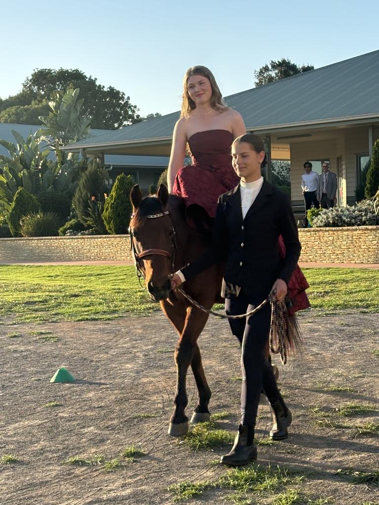 Maggie Livett arrives at Kingaroy's St John's Lutheran School formal on horseback.