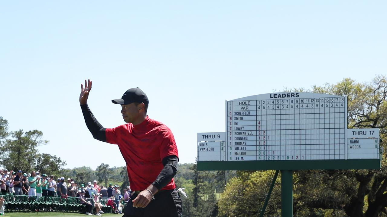 AUGUSTA, GEORGIA - APRIL 10: Tiger Woods waves to the crowd on the 18th green after finishing his round during the final round of the Masters at Augusta National Golf Club on April 10, 2022 in Augusta, Georgia. (Photo by Gregory Shamus/Getty Images)