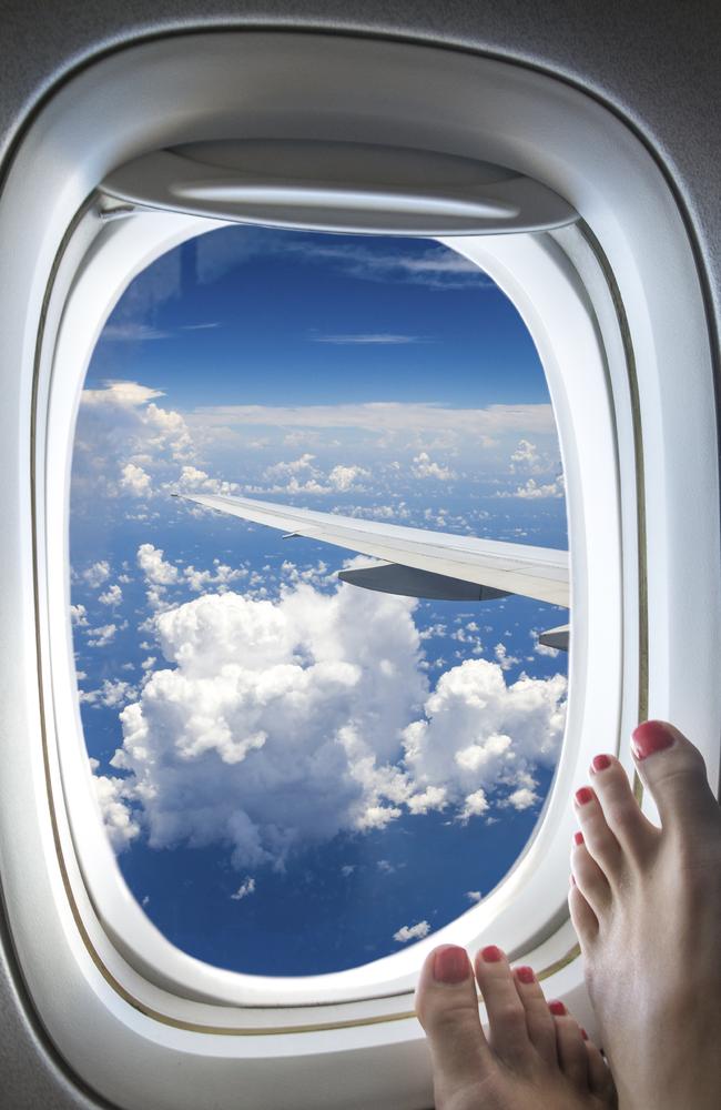 No flight attendants don’t want to see your bare feet on the windows.