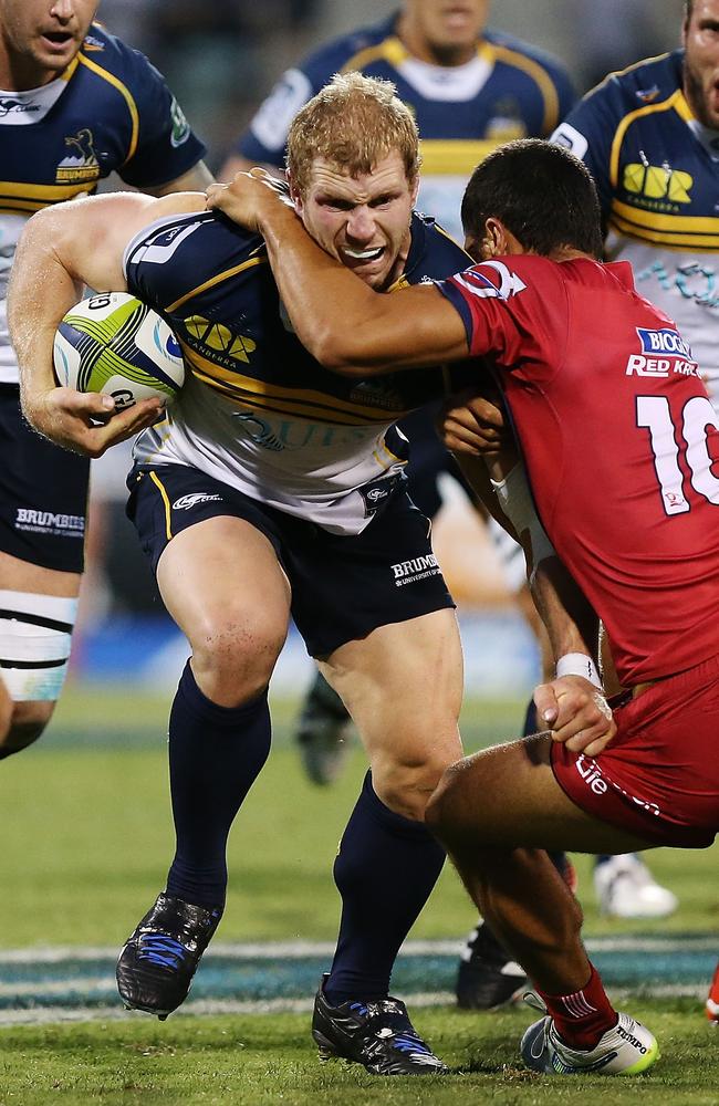 David Pocock charges into Karmichael Hunt in the Super Rugby opening round last Friday.