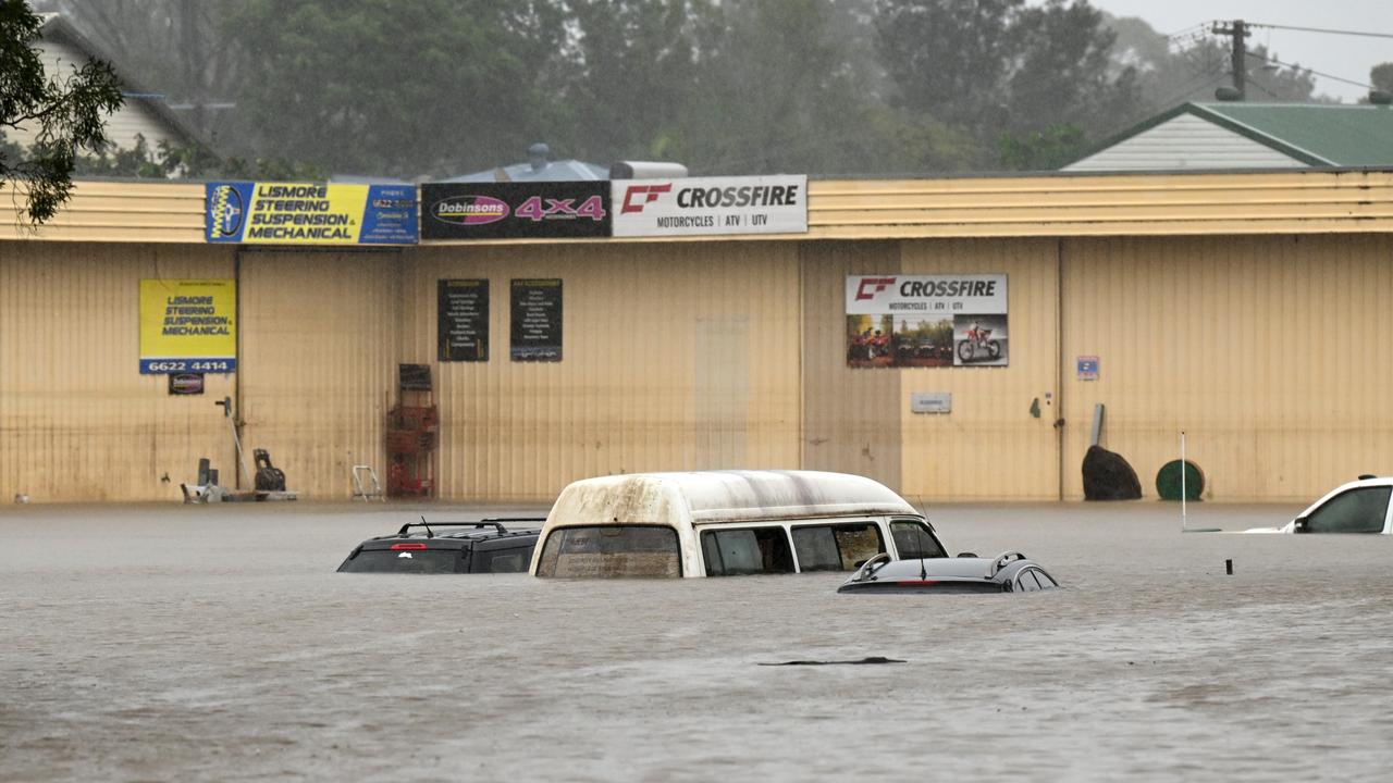 Floodwater inundates cars in Lismore. Picture: Dan Peled/Getty Images