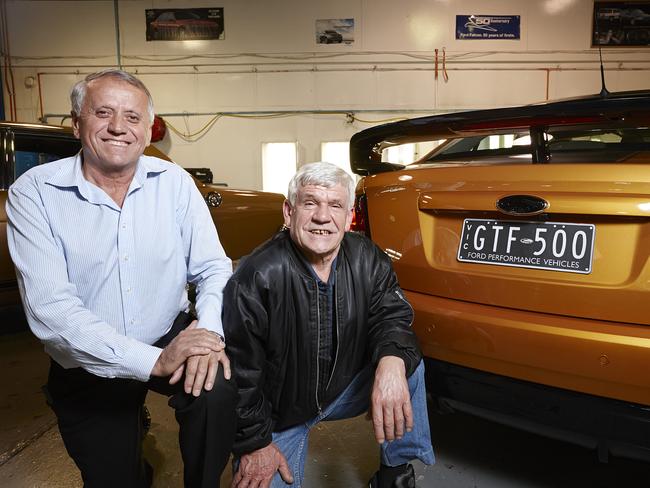 Ford workers Mick Velevski (left, who has worked for 39 years with Ford) and Boris Grujovski (right, who has been with Ford for 38 years) with the last Falcon GT sedan. Source: Supplied.