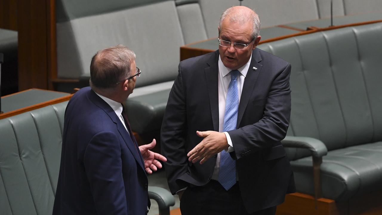 Australian Opposition Leader Anthony Albanese speaks to Australian Prime Minister Scott Morrison during debate on the 'Tax Relief So Working Australians Keep More Of Their Money' bill in the House of Representatives at Parliament House in Canberra. Picture: AAP/Lukas Coch