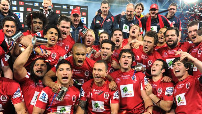 Queensland Reds players celebrate following the Reds Super 15 rugby final win over the Canterbury Crusaders Picture: AAP Image/Dave Hunt