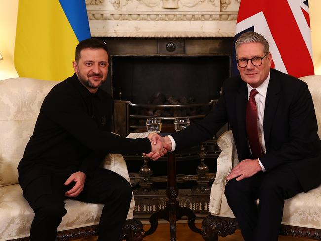 The pair shake hands during their talks. Picture: Getty Images