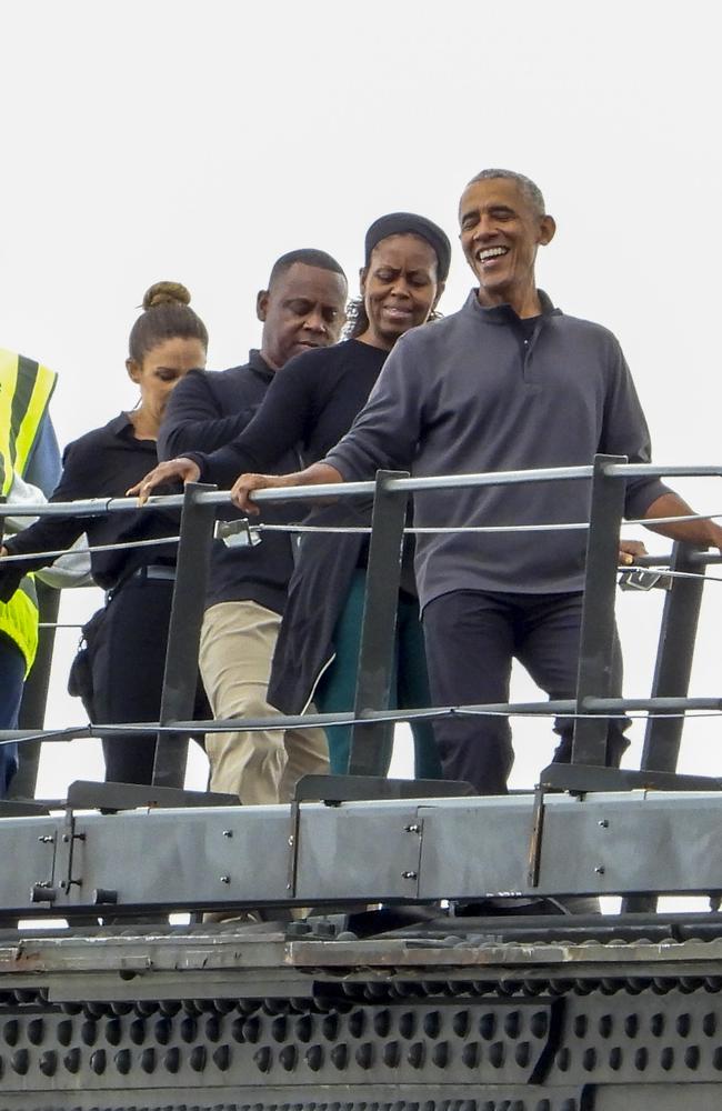 The Former USA President and First Lady, Barack and Michelle Obama, take in the Sydney sights with a private BridgeClimb walk across the Sydney Harbour Bridge. Picture: ©MEDIA-MODE.COM