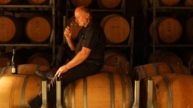 Senior Hunter valley wine maker, Peter Hall amongst the McGuigan vines with a glass of white. Picture: Sam Mooy